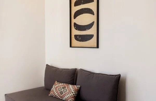 Junior Suite sofa with decoration on wall